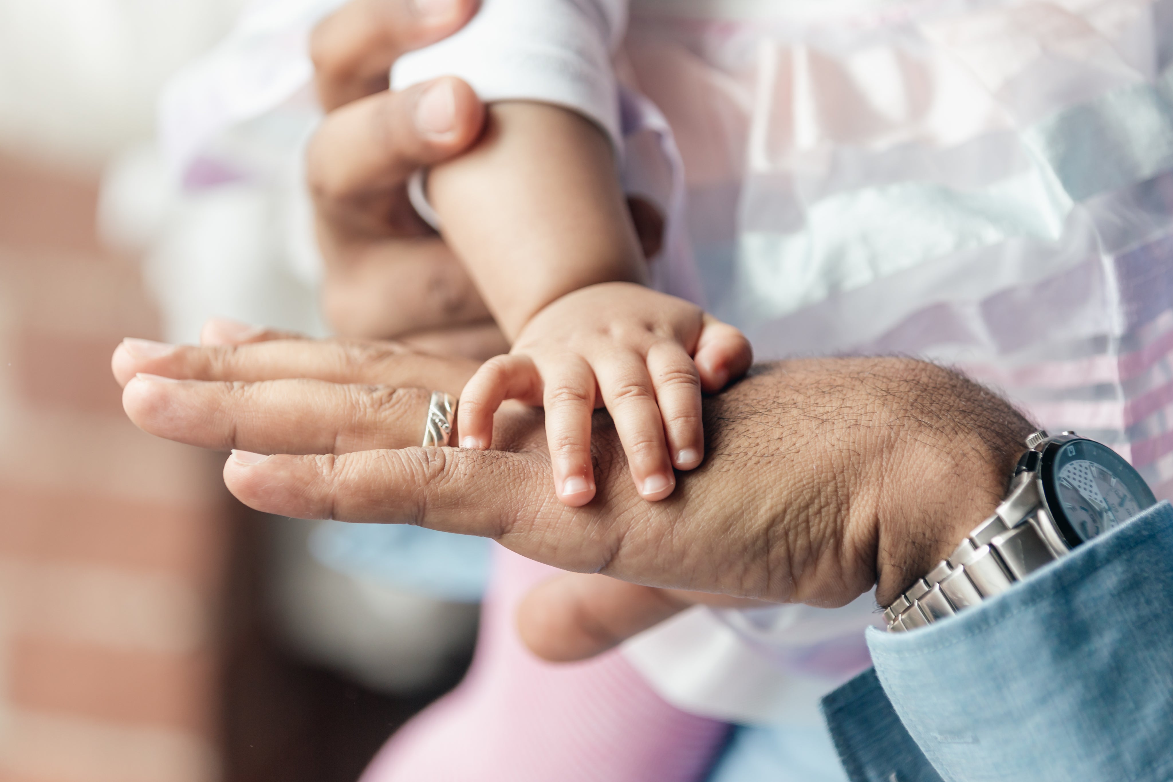 baby-girls-hand-on-dads-hand.jpg